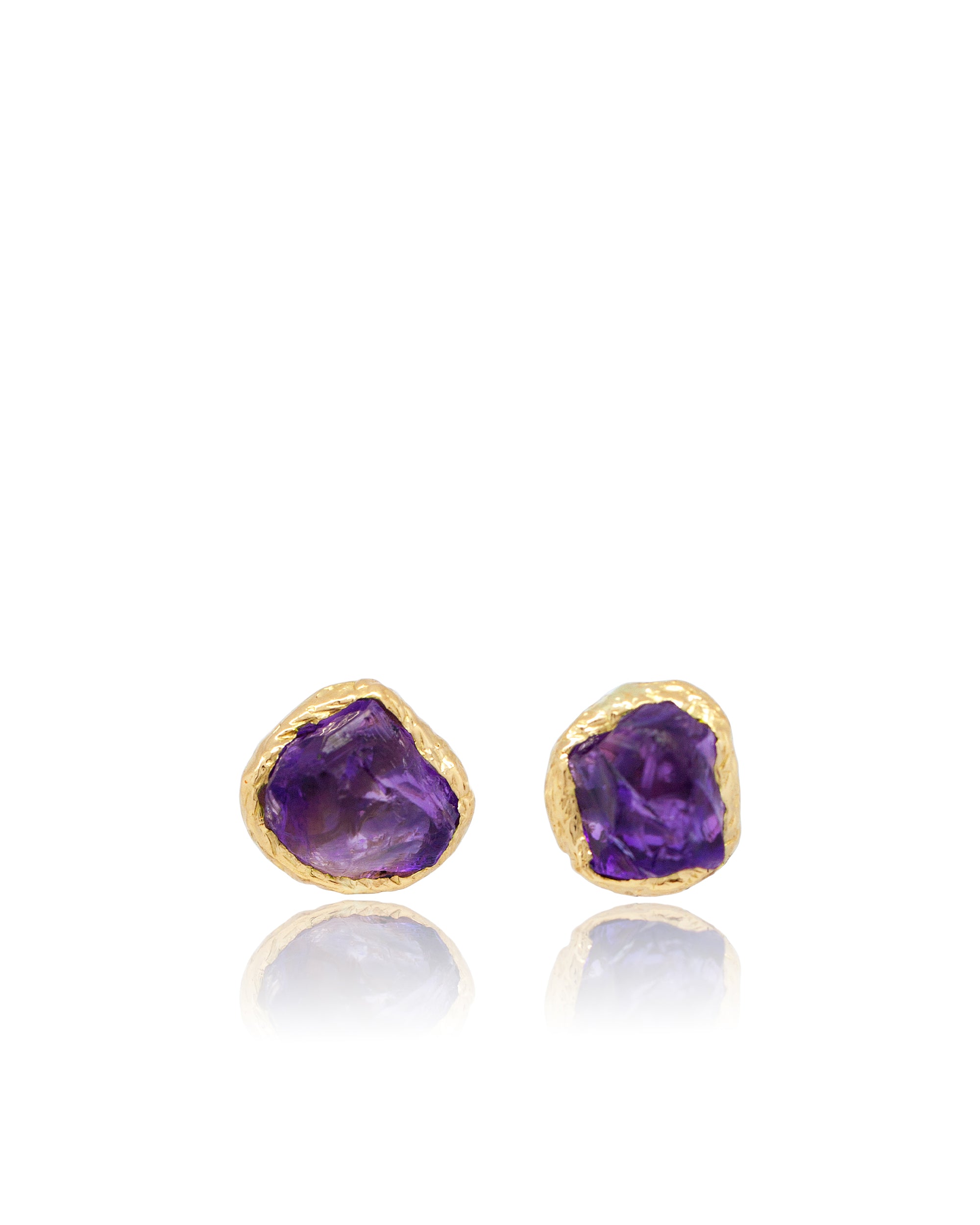 Pair of Natalie Dissel gold stud earrings featuring raw natural Amethyst gemstones set in organic textured bezels, Gem Rocks collection.