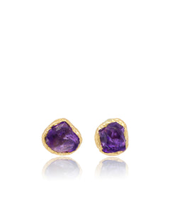 Pair of Natalie Dissel gold stud earrings featuring raw natural Amethyst gemstones set in organic textured bezels, Gem Rocks collection.
