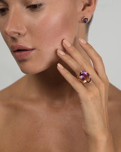 Model wearing a Natalie Dissel raw Amethyst 18k gold stud earring, styled with a statement Ametrine gemstone ring, Gem Rocks collection