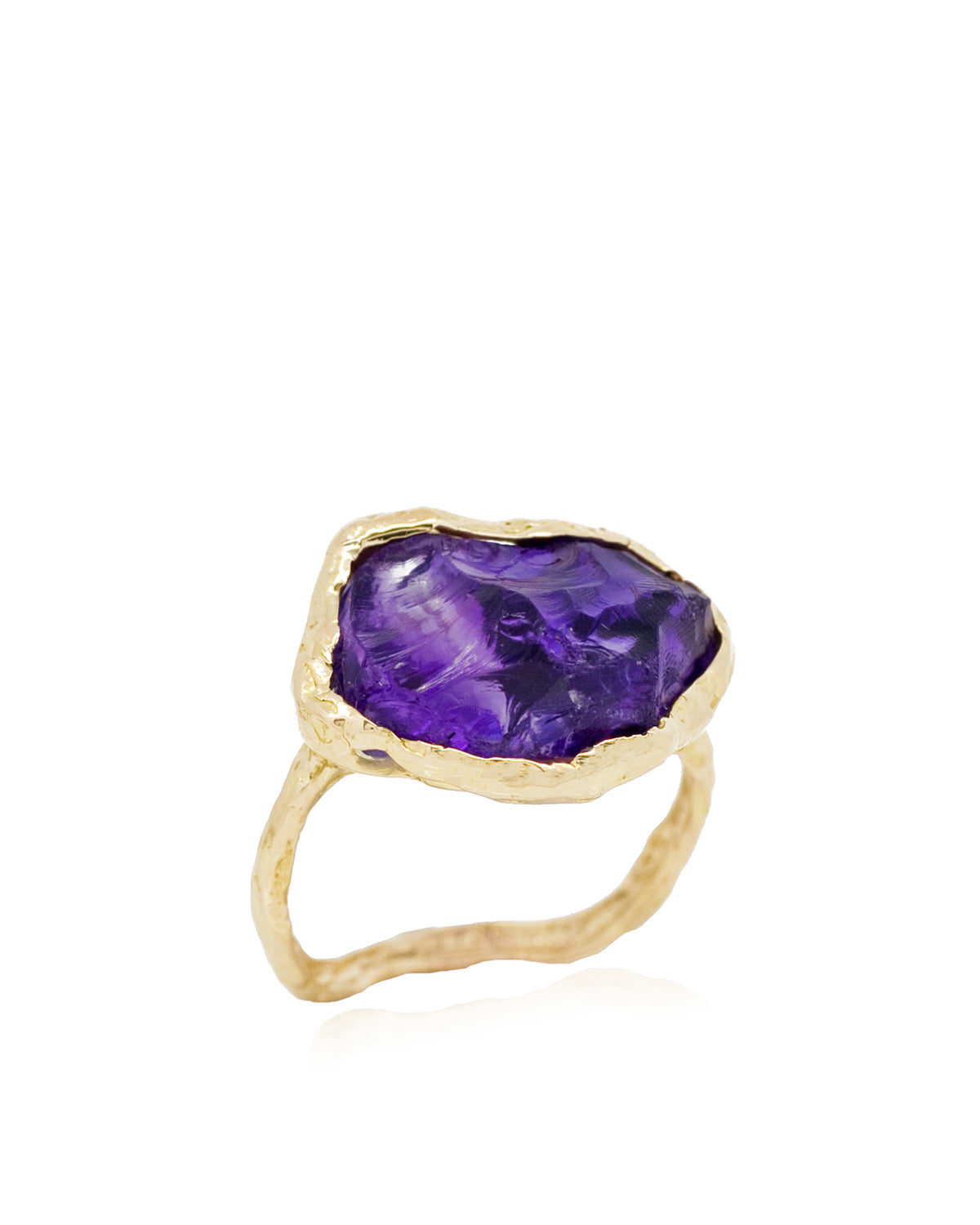 Natalie Dissel 18k rose gold ring featuring a raw natural purple amethyst stone set on a textured gold band.