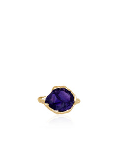 Natalie Dissel 18k yellow gold ring featuring a raw natural purple amethyst stone set on a textured gold band.