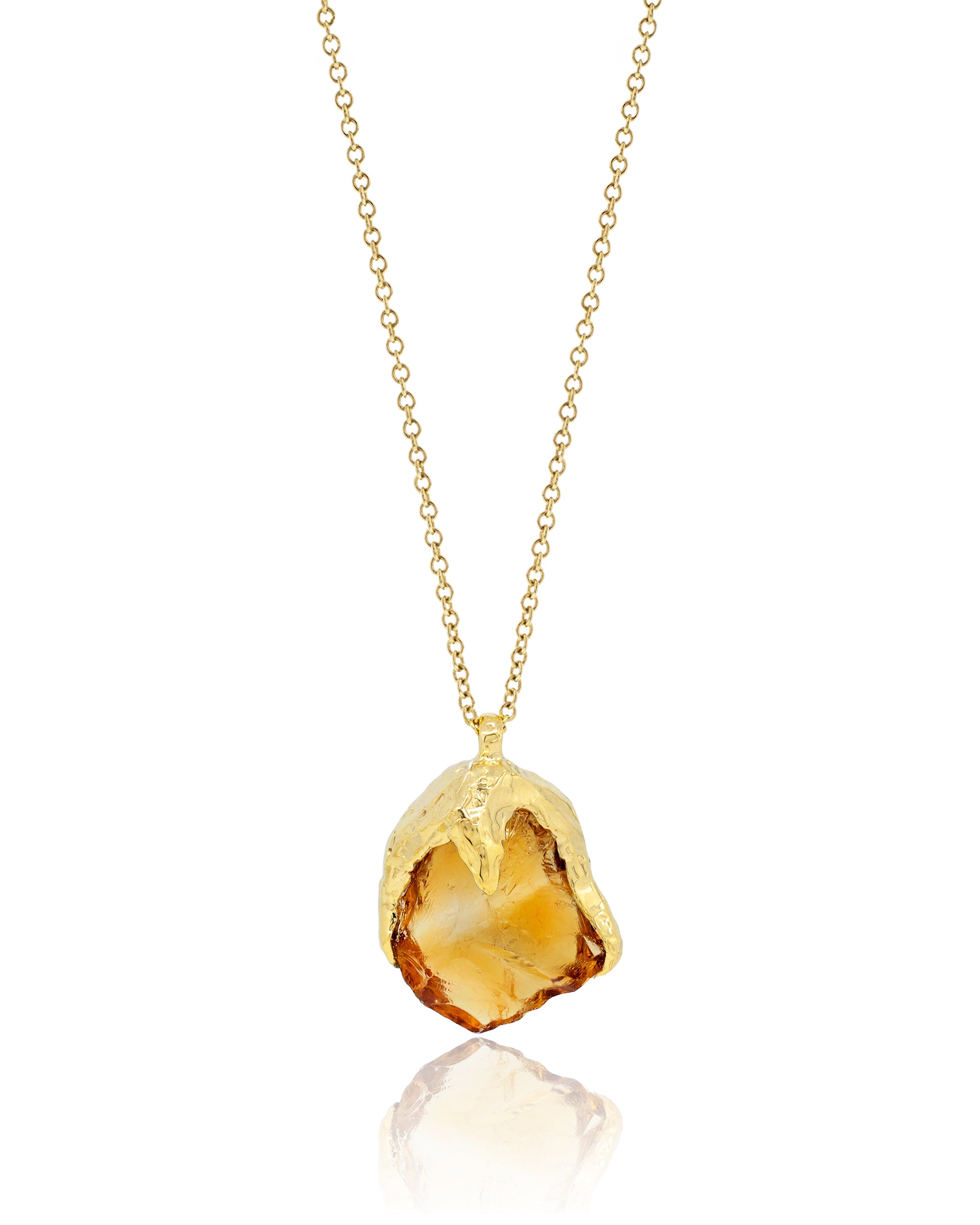 Full front view of an 18K yellow gold chain necklace featuring an organic, rough-cut citrine pendant capped in textured gold.