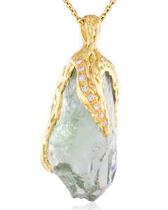 Close-up detail of Natalie Dissel 18K yellow gold pendant featuring a raw green Prasiolite crystal capped with textured gold and pavé diamonds, Gem Rocks collection.