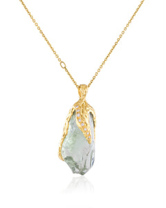 Front view of Natalie Dissel 18K yellow gold fine chain necklace holding a raw Prasiolite gemstone pendant with white diamonds, Gem Rocks collection.