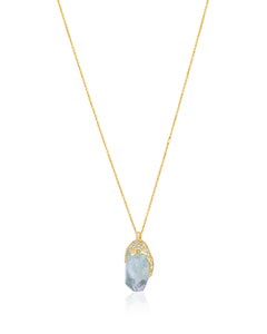 Side view of Natalie Dissel 18K yellow gold raw Prasiolite gemstone pendant showing the encrusted pavé diamond setting, Gem Rocks collection.