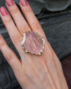 op view of the Natalie Dissel 18K yellow gold raw Rose Quartz ring worn on hand, highlighting the diamond-encrusted setting and natural gemstone.