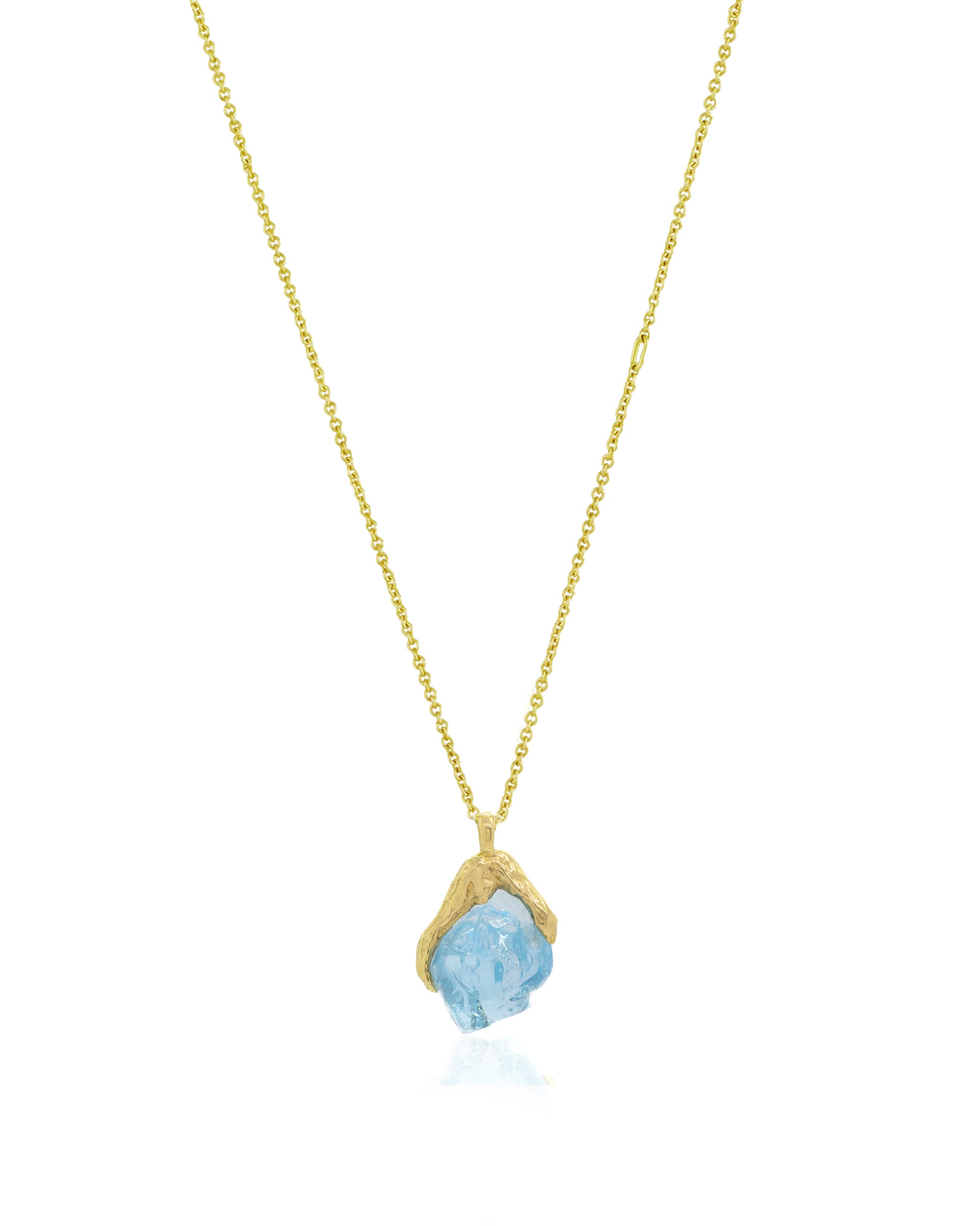 Front view of Natalie Dissel fine 18K yellow gold chain holding an uncut Sky Blue Topaz gemstone pendant set in molten gold, Gem Rocks collection.
